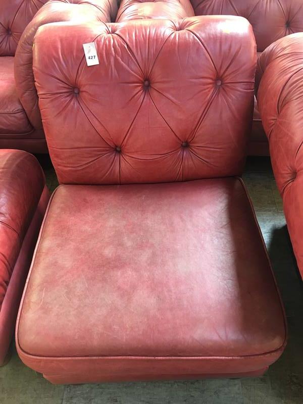Red Chesterfield style chair