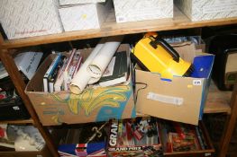 A shelf of books, including Halogen lantern and posters