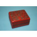 An Oriental lacquered box and cover, 7cm x 6cm