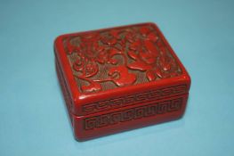 An Oriental lacquered box and cover, 7cm x 6cm