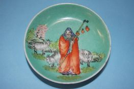 A Guangxu Period (1875-1908) small Famille Rose dish, decorated with a shepherd and his flock, 9