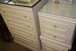 Three cream chests of drawers