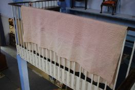 A cream handstitched Durham quilt with pink reverse