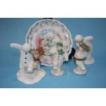 Four Royal Doulton Snowmen figures and four plates
