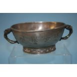 A Chinese pewter bowl with jade handles, 18cm diam