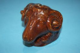 A salt glazed Ram's head money box