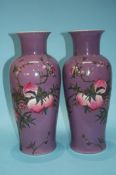 A pair of large purple Oriental vases, decorated w