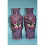 A pair of large purple Oriental vases, decorated w