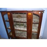 An Edwardian mahogany Art Nouveau china cabinet