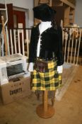 A children's tartan outfit, including kilt, sporran, jacket and Glengarry and two toboggans
