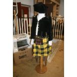 A children's tartan outfit, including kilt, sporran, jacket and Glengarry and two toboggans