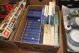 A box of books, including Dickens, Churchill and local interest