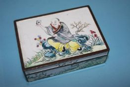 A Canton enamel card case and cover, depicting an old man holding a handful of playing cards, 7cm