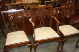 A 19th century mahogany dining table and a set of five single and one carver chair