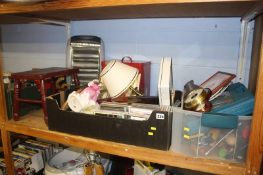 A shelf of miscellaneous, including a Royal Doulton figure and barometer