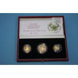 A 1986 UK gold proof set, £2 coin full and a 1/2 sovereign