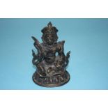 A Tibetan bronze figure of a Deity, 11cm high