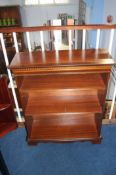 A reproduction mahogany bookcase and a corner unit