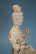 A blanc de chine Guan Yin seated on an elephant, 3