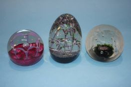 Three boxed Caithness paperweights
