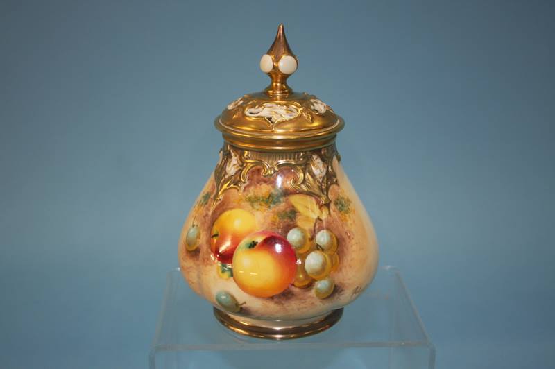 A Royal Worcester vase and cover, decorated with p