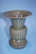 A Chinese Celadon crackle glaze octagonal vase with flared rim, 20cm high