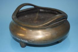 A large bronze censor, with markings to base, 12cm high