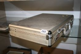 An aluminium attache case of coins and miscellaneous