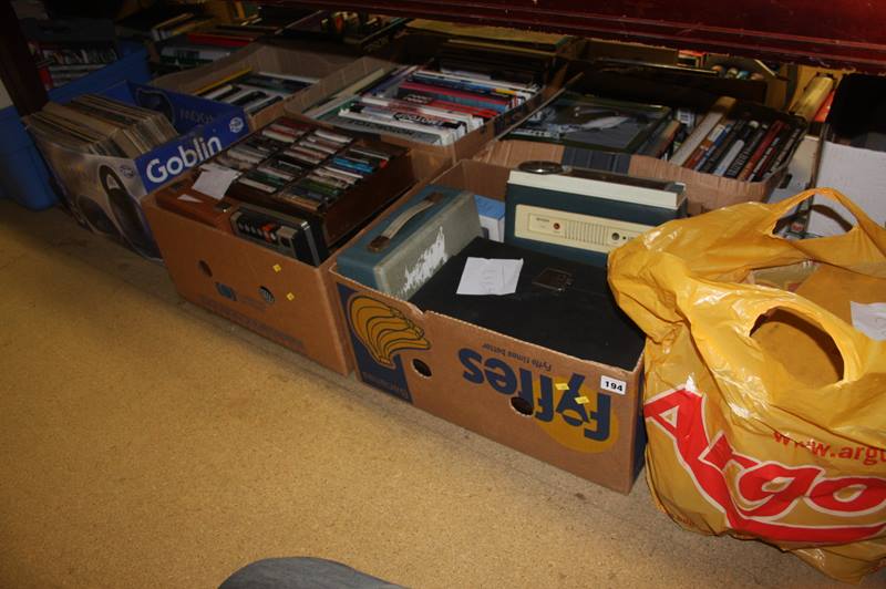 A large quantity of vinyl CDs and cassettes, including a movie projector