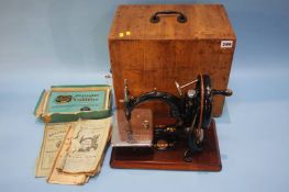 A Wilcox and Gibbs, sewing machine with case and accessories