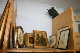 A shelf of framed pictures