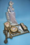 A Lladro figure and a dressing table set