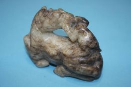 A spinach jade figure group of a monkey riding a h