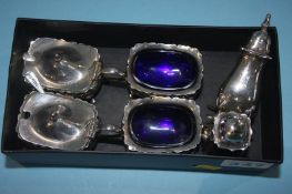 A silver six piece cruet set