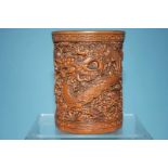 A bamboo brush pot, decorated with Dragons, 12cm high