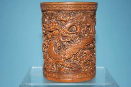 A bamboo brush pot, decorated with Dragons, 12cm high