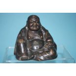 A bronze figure of a seated Buddha, 11cm high