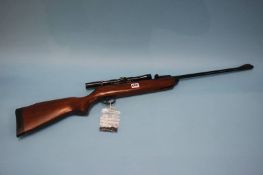 A BSA 22 air rifle with telescopic sight and a quantity of shooting bags