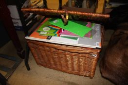 A wicker basket, including artists/crafting materials