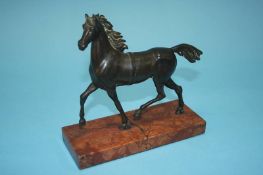 An 18th century bronze horse on a marble base, 17cm