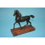 An 18th century bronze horse on a marble base, 17cm