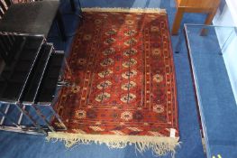 A Pakistani Bokhara rug, two rows of guls, highlig