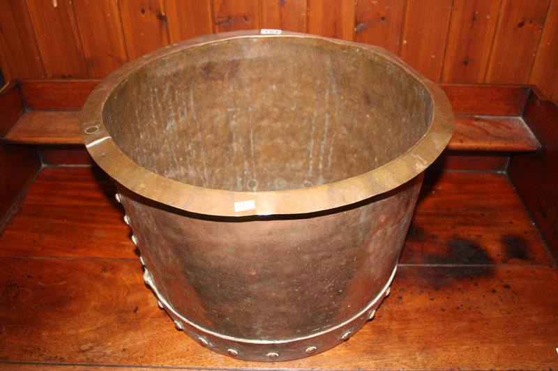 A large copper log bin