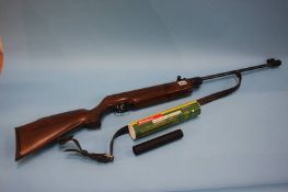 A Weihrauch air rifle and silencer