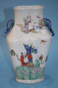 A Chinese vase with elephant handles, decorated wi