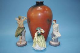 A large modern vase and three Doulton figures