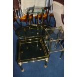 A collection of four various glass top tables