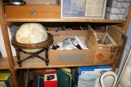 A shelf of miscellaneous including a globe on stand