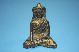 A gilt bronze figure of a Buddha, 8.5cm high