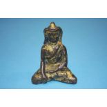A gilt bronze figure of a Buddha, 8.5cm high